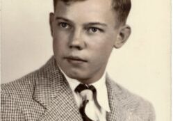 A young man in a suit and tie.