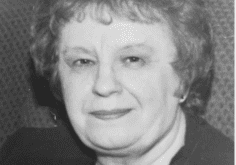 A black and white photo of an older woman.