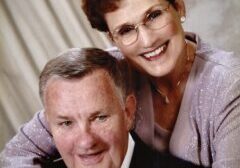 A man and woman posing for a picture.