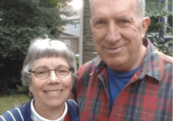 A man and woman standing next to each other.