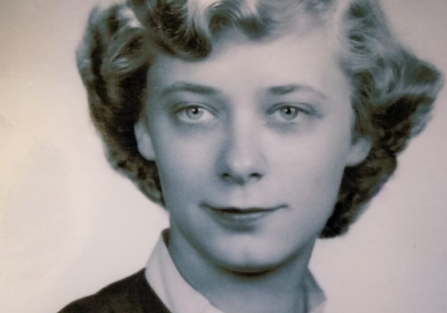 A woman with short hair is smiling for the camera.